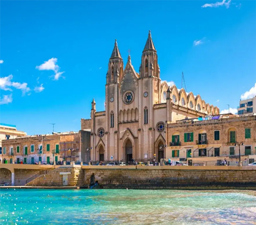St. Paul’s Pro-Cathedral in Valletta, Malta, by the waterfront with historic buildings